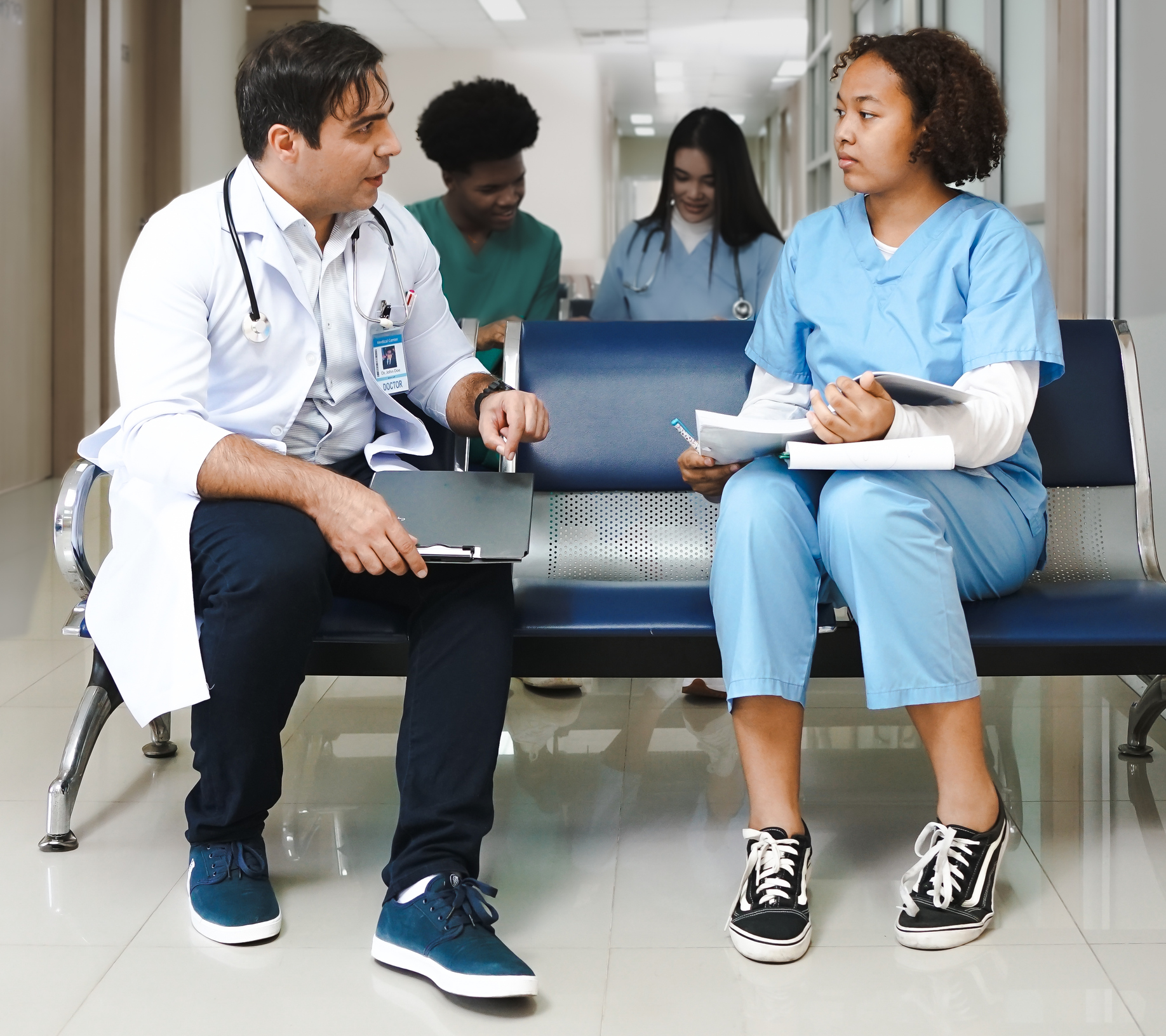 Male doctor mentoring medical student