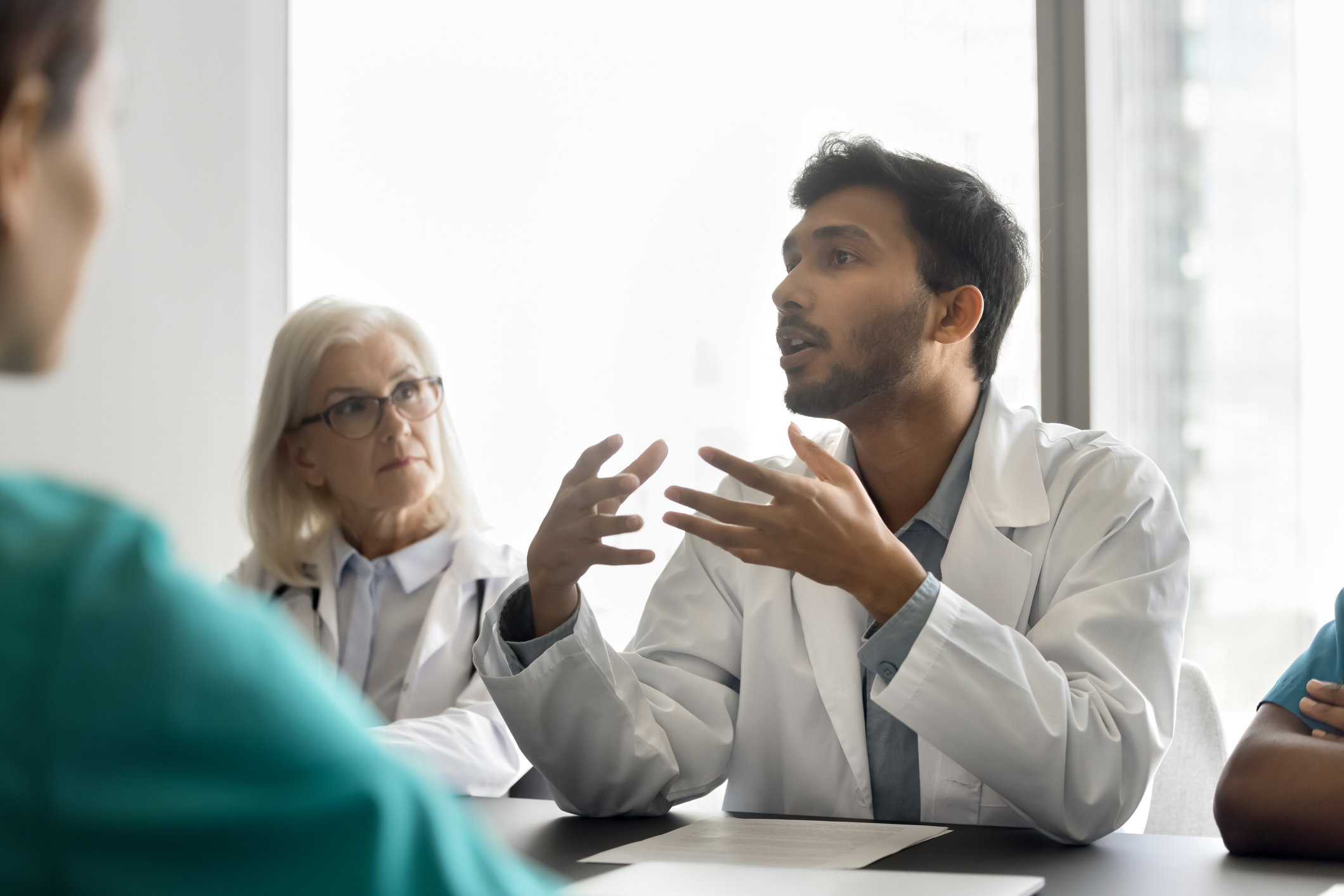 Doctor speaking to colleagues