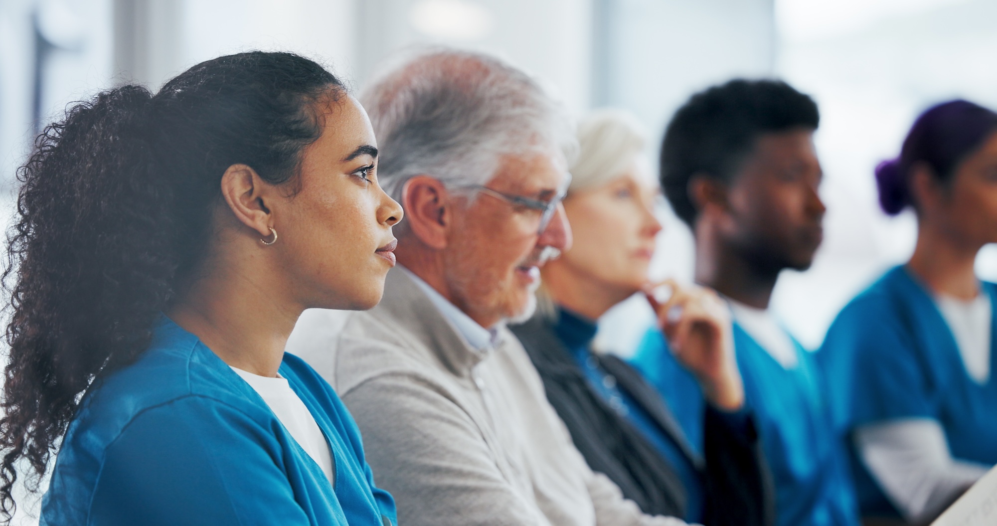 diverse medical team meeting and listening